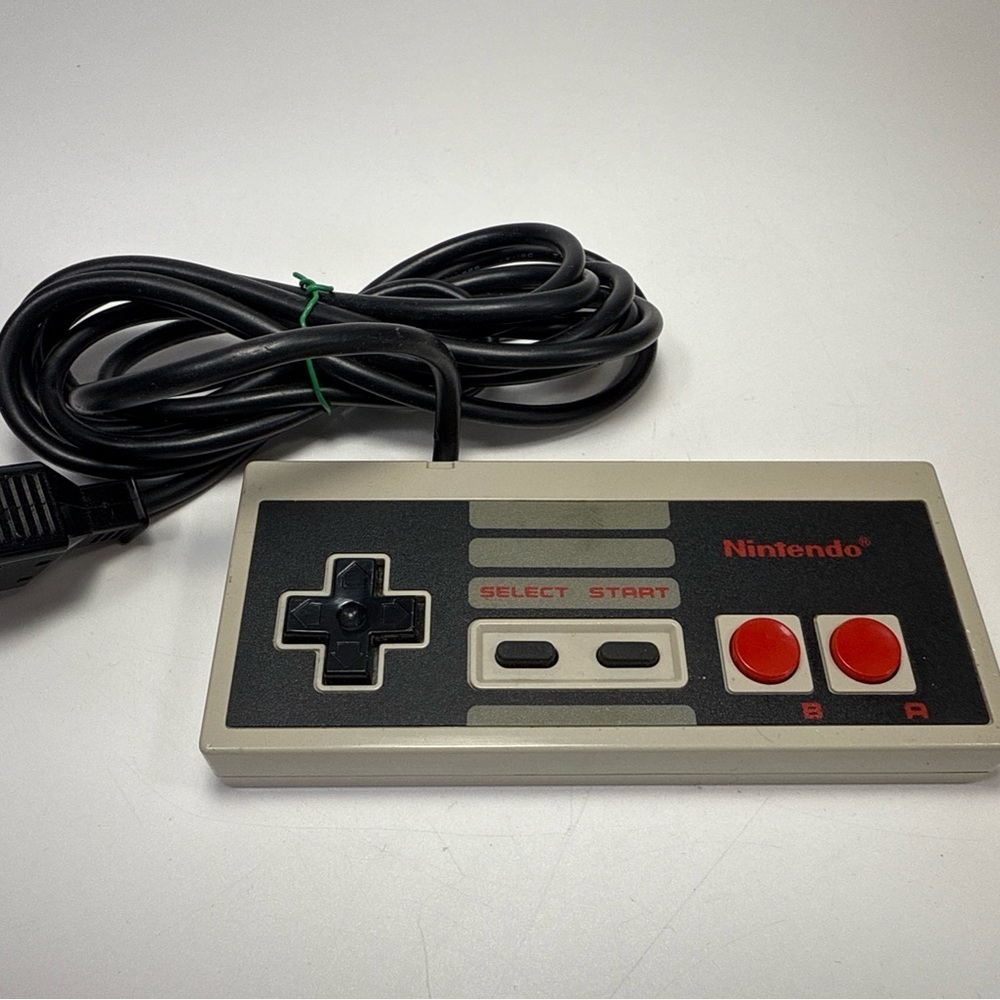 Nintendo OEM NES Retro Black and Gray Controller good condition.